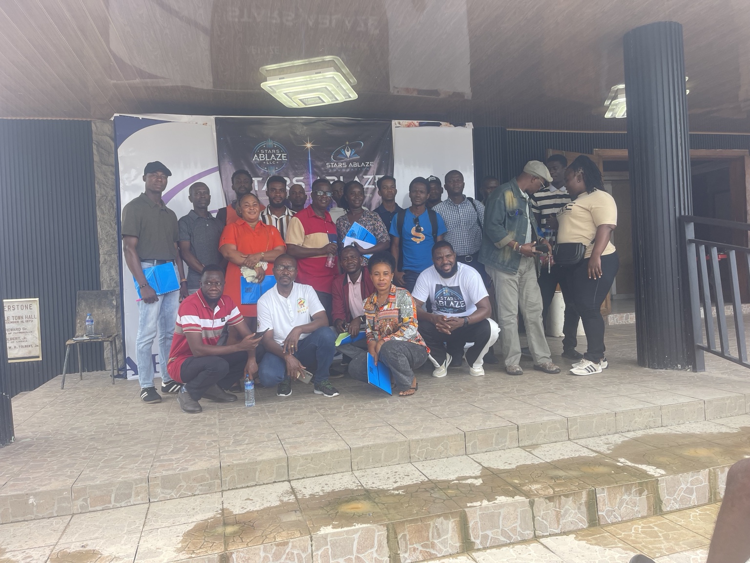 Graduates of the Free AI Training gathered on the steps of Paynesville Town Hall
