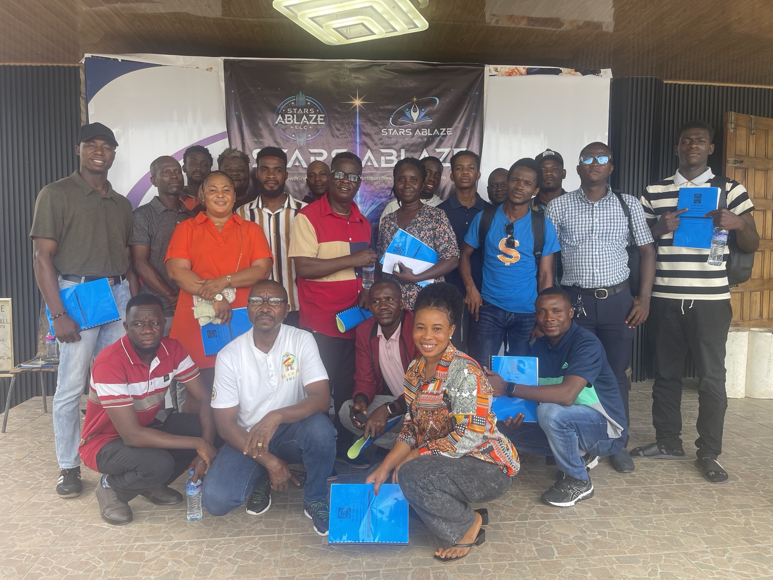 Free AI Training participants holding their certificates at Paynesville Town Hall